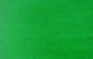 Fototapeta premium Rough bright hard green cardboard, sheet as texture, background or backdrop for holiday decoration