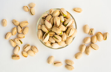 roasted pistachios on white background