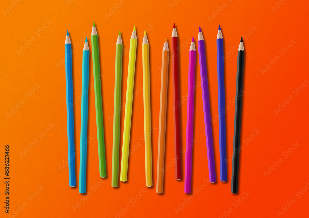 Canvas Prints Colored pencil group isolated on orange. Horizontal background