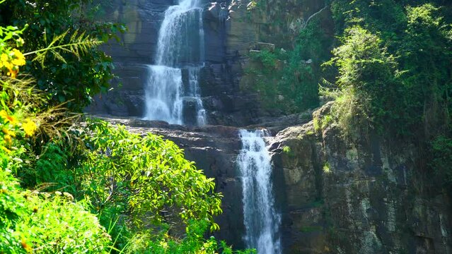 View of waterfall cacscade in mountains at tropical forest. Ramboda waterfall