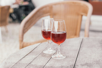 A moscatel wine tasting, two wine glasses on a wooden table