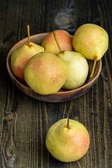 harvested sweet ripe pear in drops of water
