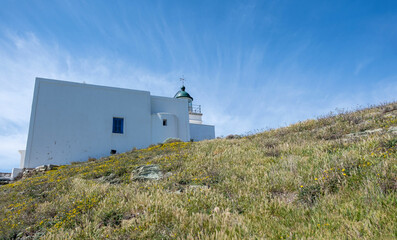 Cyclades, Greece. Kea island. Traditional lighthouse white building against blue sky,
