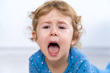 Child crying tears face girl. Selective focus.