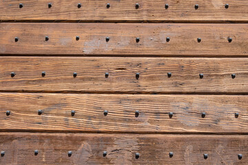 Wood background, texture. Wooden board planks with nails decoration