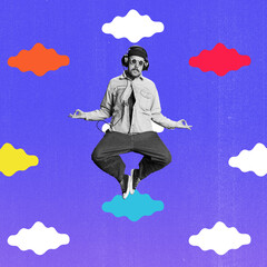 Young man, hippie listening to music in headphones and jumping against colorful background....