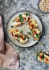 Sandwiches with fried bread sour cream figs and sprinkled with honey