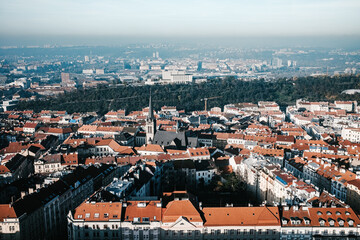Fototapeta na wymiar Panorama city Prague from height. View from Observation deck in Zizkov TV Tower