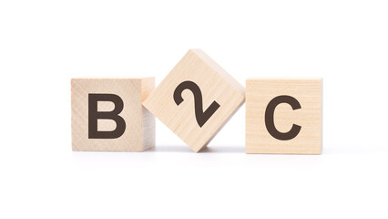 b2c - wooden blocks with letters, top view on white background