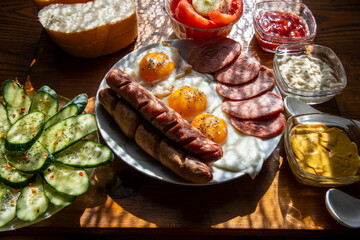 Breakfast with fried egg, hot dog and ham...