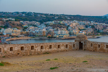 Sunset view of Venetian Fortezza Castle in Greek town Rethimno, Crete