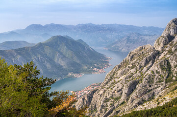Fototapeta na wymiar Aerial view of famous Kotor bay with picturesque rocks, old town and cruise ship at the port.