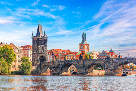 Prague - Charles bridge, Czech Republic. Scenic aerial sunset on the architecture of the Old Town Pier and Charles Bridge over the Vltava River in Prague, Czech Republic.