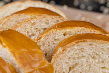 Wheat baguette on a wooden cutting board
