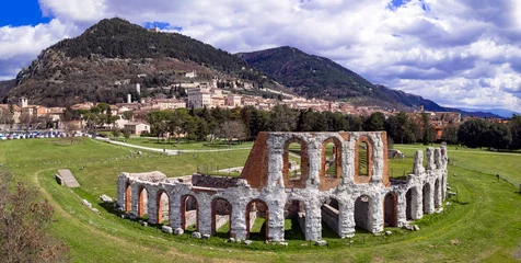 Foto op Canvas great historical italian landmarks - impressive Gubbio town in Umbria. Aerial drone panoramic view of roman amphitheater. Italy travel © Freesurf