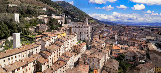 great historical italian landmarks and best tourist destinations - impressive Gubbio in Umbria. Aerial drone panoramic view of medieval town. Italy travel