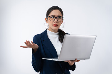 Tired Asian businesswoman in stress works holding laptop computer isolated on white background.