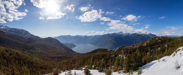 Canadian Mountain Landscape during sunny evening. Howe Sound near Squamish, British Columbia, Canada. Panoramic Nature Background