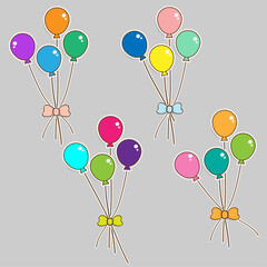 Colorful paper balloons with bows