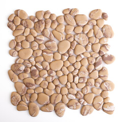 Fototapeta na wymiar Ceramic mosaic of river pebbles cream and brown for walls, Mosaic of river stone. Interior design.