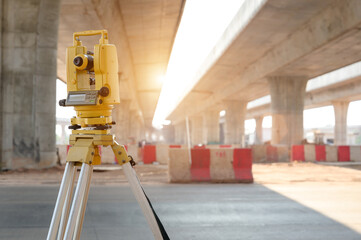 theodolite on construction site Surveyor Engineer uses theodolite to mark coordinated concrete piles