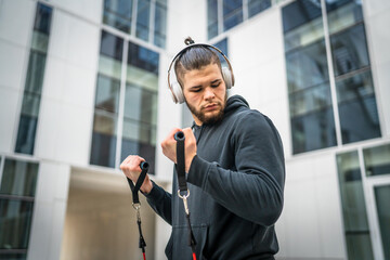 Naklejka premium One man training use rubber elastic resistance band tubes outdoor