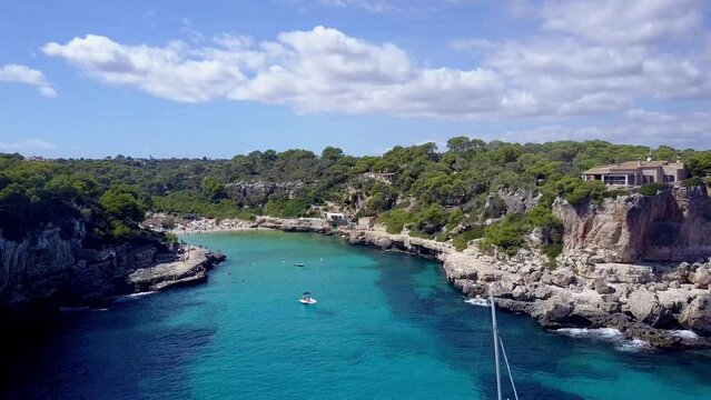 Cinematic Drone Shot passing Yachts in a beautiful Bay in Mallorca