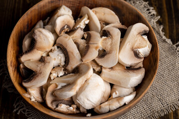 Peeled, washed and cut mushrooms champignons during cooking