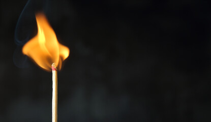 the beginning of working life , burning matchstick and smoke on black background with copy space , business concept