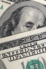 several American hundred dollar bills close-up