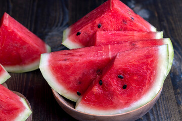 Sliced red and ripe watermelon on the table