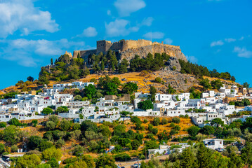 Acropolis of Lindos overlooking traditional white houses at Rhodes island, Greece