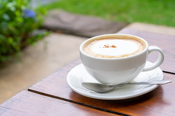 Hot coffee cappuccino on wooden table