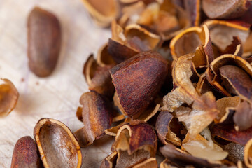 a bunch of pine nuts in the shell