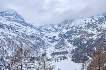 Fototapeta na wymiar The famous Swiss mountain train of Bernina Express crossed italian and swiss Alps