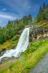 Fototapeta na wymiar Steinsdalsfossen waterfall at Kvam in Norway