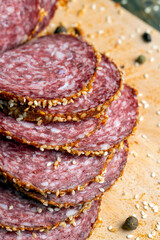 Sliced beef sausage with spices and lots of sesame seeds