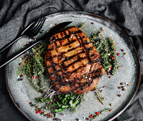 Grilled pork chop dish with spices on a plate