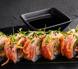 tuna sushi roll on black board