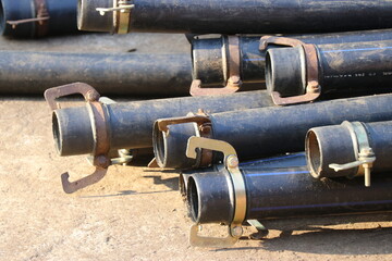 Group of HDPE pipe with metal clamps used in water supply