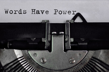 Text Words Have Power typed on retro typewriter