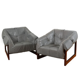 Grey leather lounge chairs. Mid-century vintage living room furniture with no background.