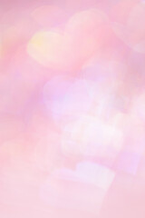Defocused abstract bokeh background with pink pastel colored hearts, flare from lights, blurred bokeh holiday, celebration wallpaper. love and romance aesthetic photo, glittering lights pattern
