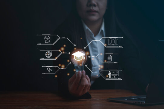 Woman holding lightbulb showing graduation hat, Internet education course degree study knowledge to creative thinking idea and problem solving solution. E-learning graduate certificate program concept