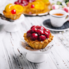 delicious cake with cherries and tea