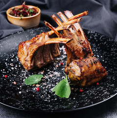 Beautifully grilled lamb rib chop steaks on plate