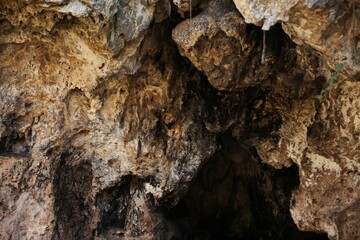 Cave entrance, rock of different shades, as a background