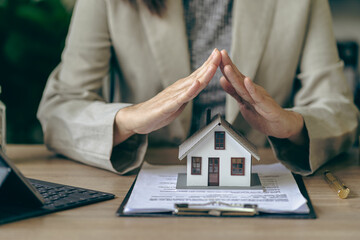 Home insurance and family health concept Insurance agent presenting hand drawn protection symbol...