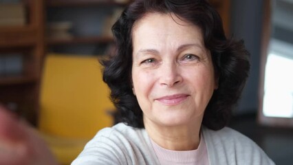 Portrait of confident stylish european middle aged senior woman. Older mature 60s lady smiling at home. Happy attractive senior female looking camera close up face headshot portrait. Happy people