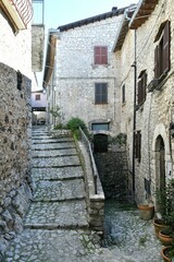 A narrow street among the old houses of Fumone, a historic town in the state of Lazio in Italy.